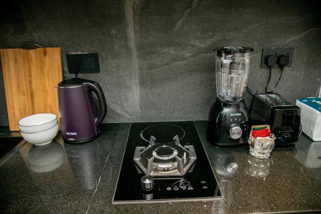 The kitchen counter, with kettle, blender and toaster