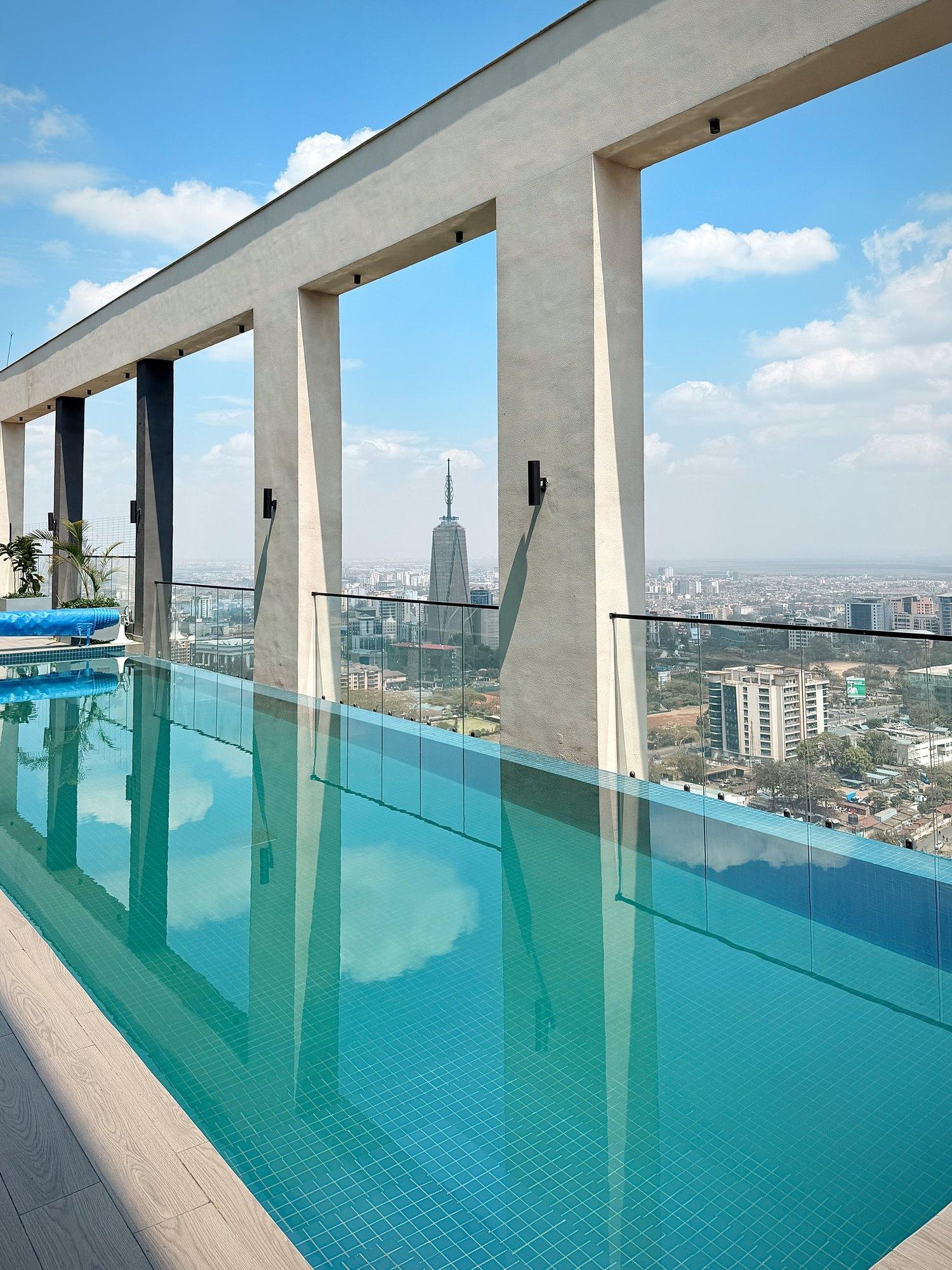 The rooftop pool, with the Nairobi skyline beyond the glass