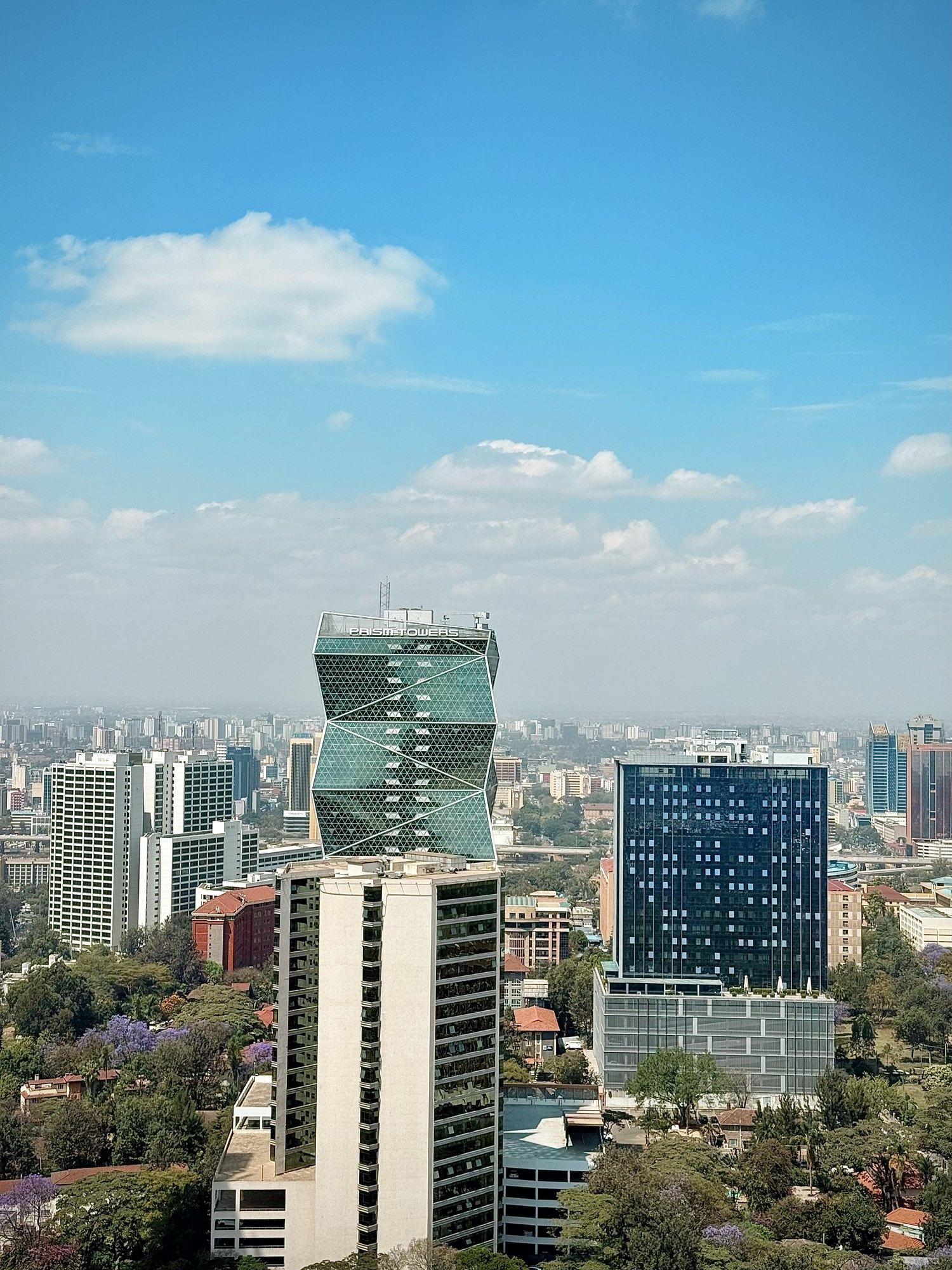 Prism Towers and Upper Hill under a blue sky